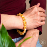 Golden Healer Quartz bracelet from Conscious Items featuring polished golden stones on a delicate string.