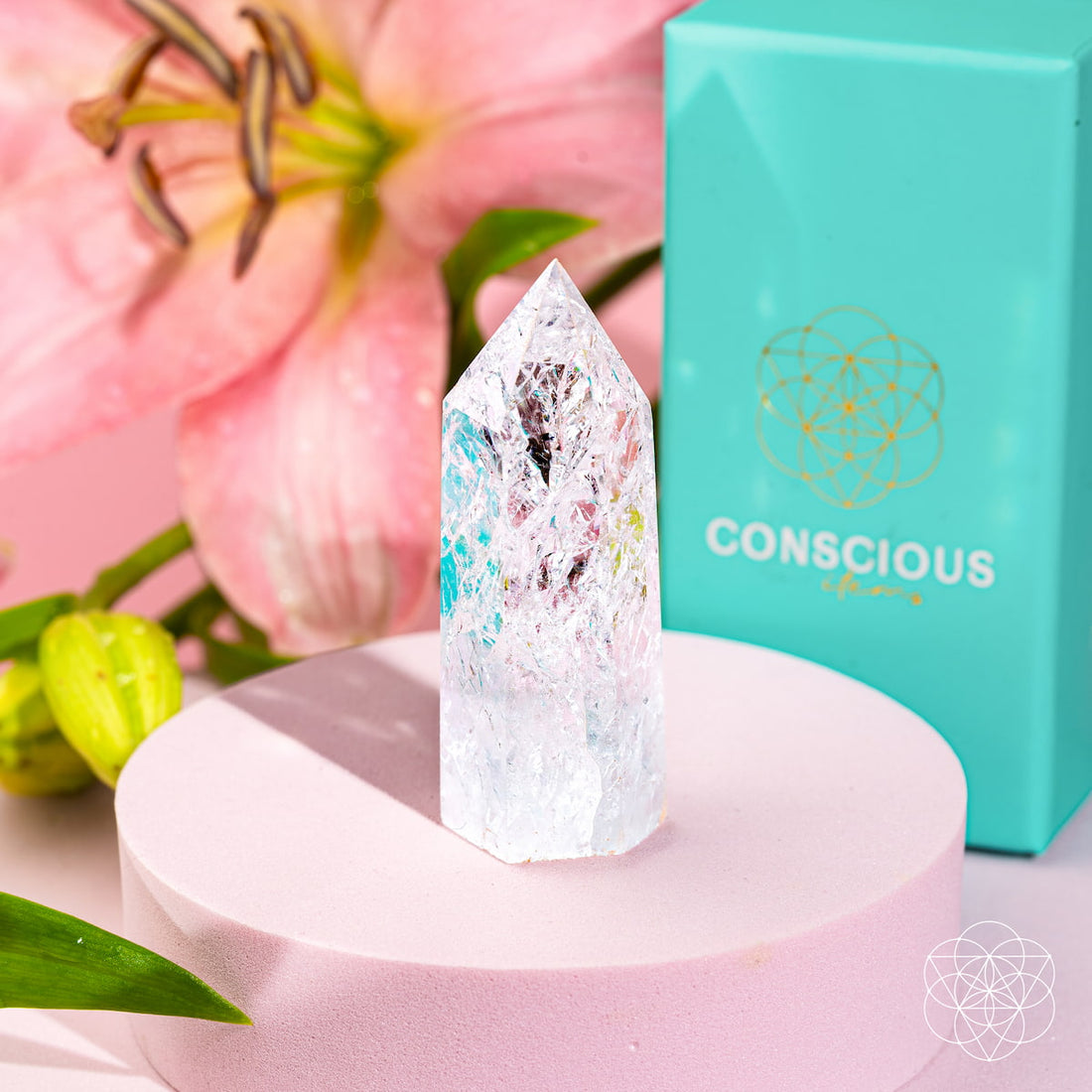 Ice quartz point from Limitless Manifestation by Conscious Items, used as a home decoration, showing a clear, polished crystal tip.