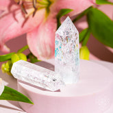 Ice Quartz Point home decoration by Conscious Items, showcasing a clear, polished crystal with natural facets for positive energy.