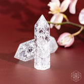 Ice quartz point home decoration from Conscious Items, showcasing a clear, polished crystal with natural facets for positive energy.