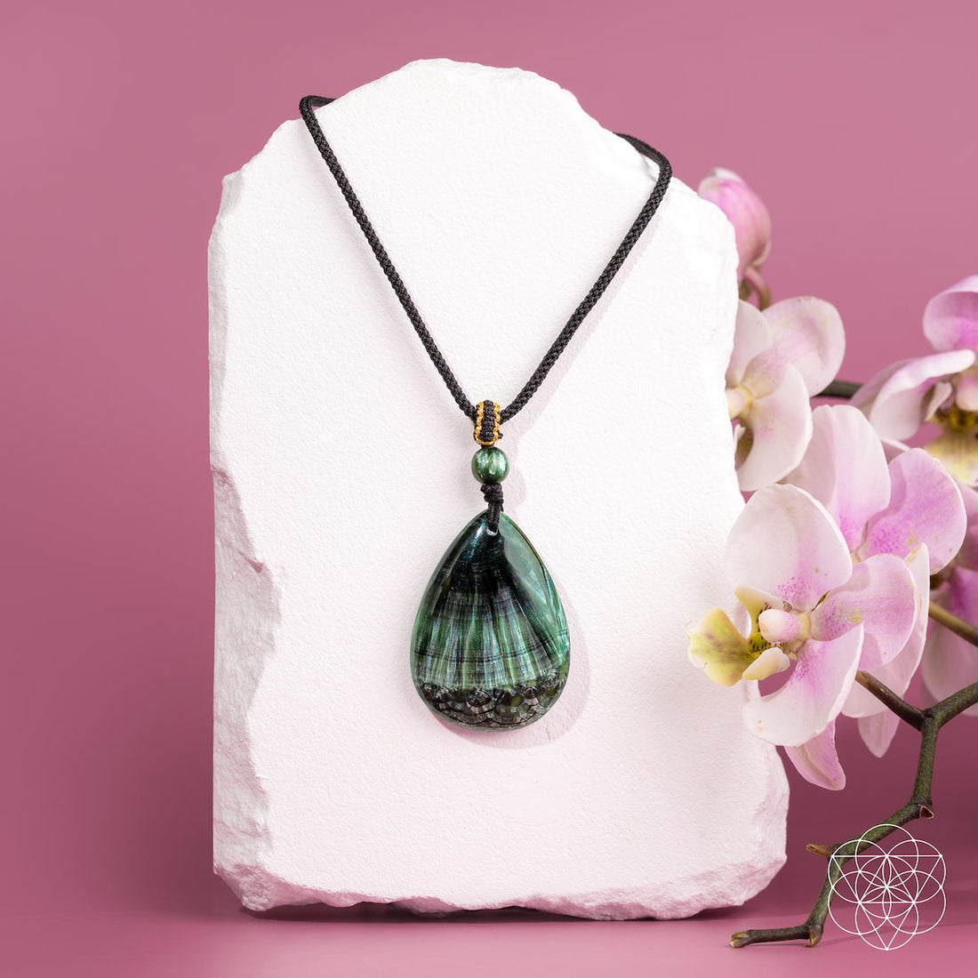 Seraphinite pendant necklace titled The Angel by My Side from Conscious Items, featuring a polished green gemstone pendant on a chain.