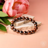 Mahogany Obsidian bracelet from Conscious Items featuring natural stone beads on a stretch cord.
