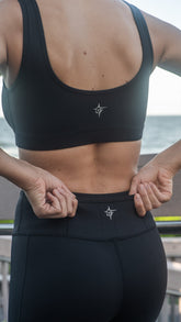 White Water Life HydroFlex cut out leggings displayed on a model, showcasing their sleek design and flexible fabric for active wear.