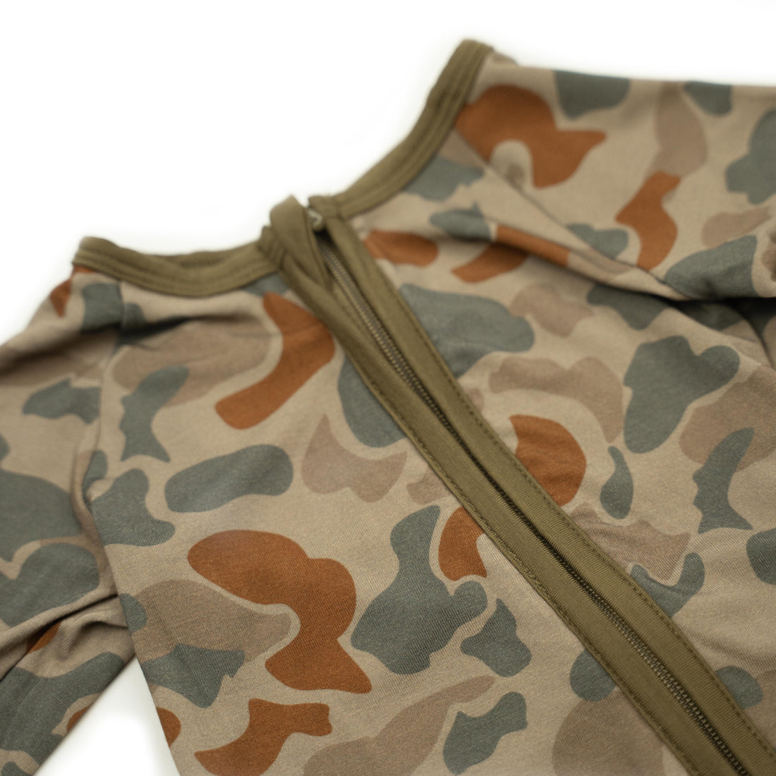 Baby Zippy from Bow Crew Apparel featuring woodland camo design, ideal for outdoor and hunting-themed baby clothing.