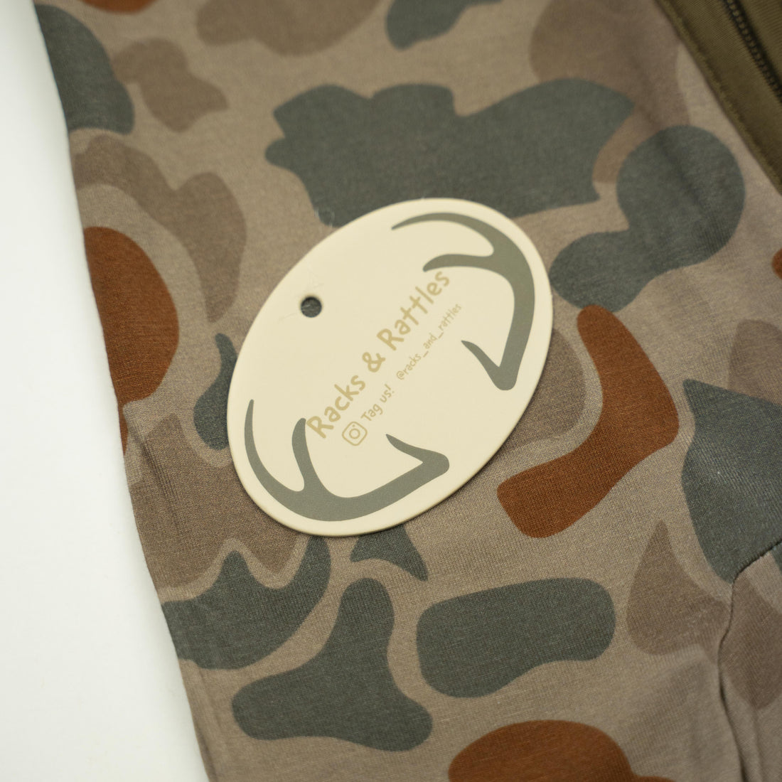 Baby Zippy jacket by Bow Crew Apparel with woodland camouflage pattern, soft fabric, and front zipper for a comfortable outdoor look.