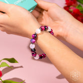 Pink Galaxy Tiger’s Eye bracelet from Conscious Items featuring smooth, polished tiger’s eye beads on a delicate elastic band.
