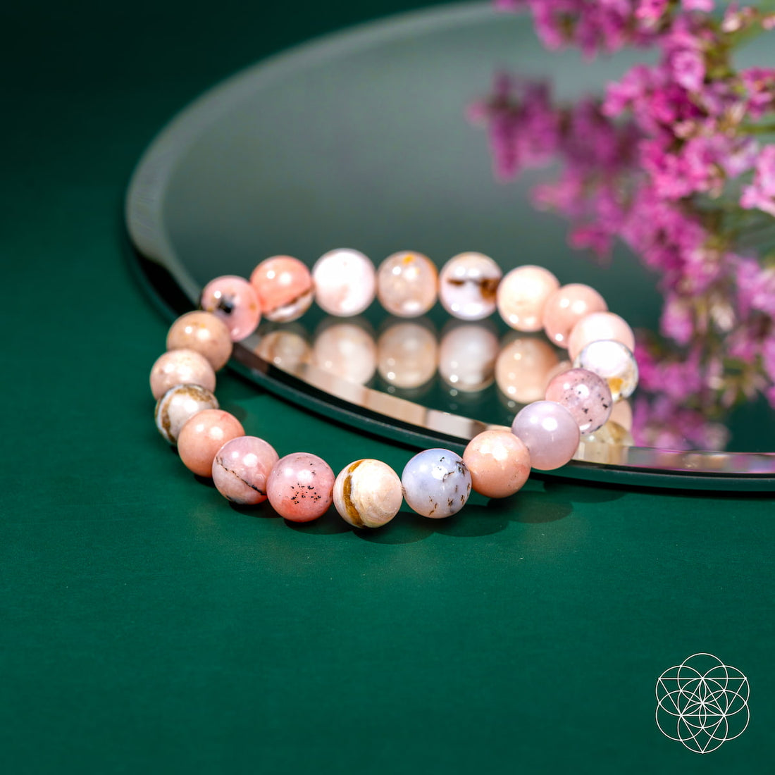 Peruvian pink opal bracelet from Conscious Items featuring pink gemstone beads on a durable elastic band.