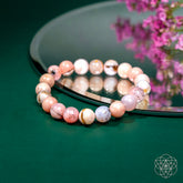 Peruvian pink opal bracelet from Conscious Items featuring pink gemstone beads on a durable elastic band.