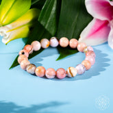Peruvian Pink Opal bracelet from Conscious Items featuring pink gemstone beads and a delicate, handcrafted design.