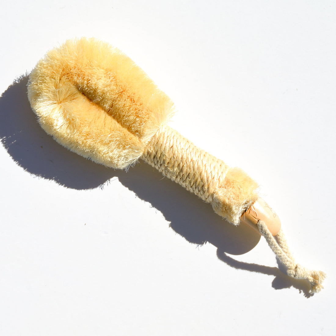 Pretty Farm Girl sisal exfoliating dry brush for skin exfoliation, featuring natural sisal bristles and a wooden handle.