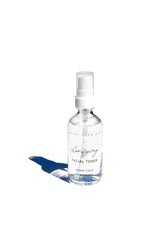 Pretty Farm Girl Clarifying Hypochlorous Acid Toner bottle on a white background, showcasing the skincare product.