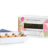 Pretty Farm Girl bamboo soap dish holding a facial sponge, eco-friendly bathroom accessory with natural bamboo finish.