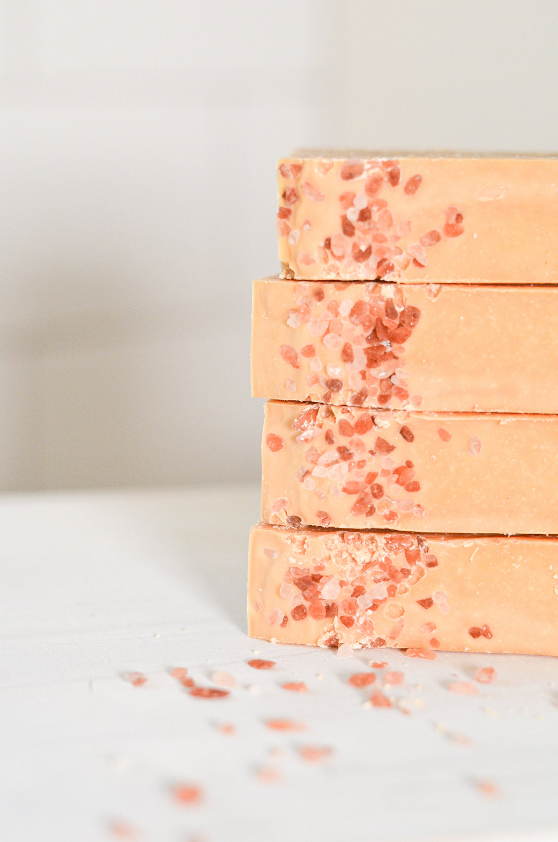 Handmade pink salt and grapefruit cleansing bar soap by Pretty Farm Girl, featuring tallow and goat milk ingredients.
