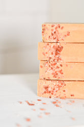 Handmade pink salt and grapefruit cleansing bar soap by Pretty Farm Girl, featuring tallow and goat milk ingredients.