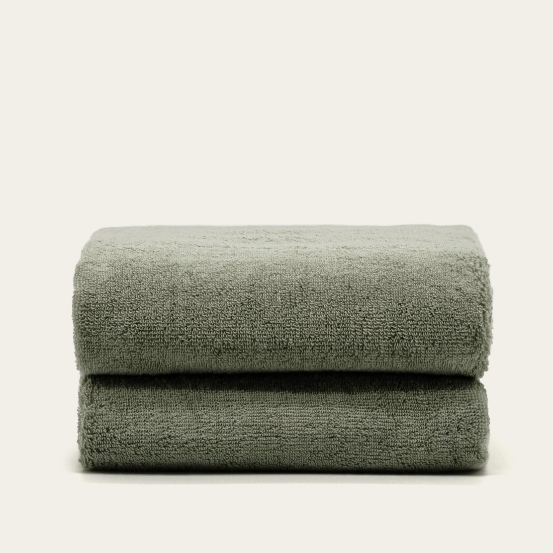 Soft Deia Australian cotton bath towel from Italic, shown hanging, showcasing plush texture and natural white color.