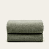 Soft Deia Australian cotton bath towel from Italic, shown hanging, showcasing plush texture and natural white color.