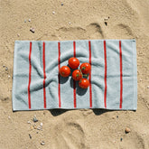 Italic Deia Australian cotton hand towel displayed on a bed, showcasing soft, plush texture and elegant design for home decor.
