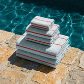 Set of Deia Australian Cotton Towels from Italic, displayed on a bed, showcasing soft, plush texture and elegant design for home use.