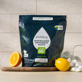 Puracy Citrus Skies dishwasher detergent pods in a 50-count package, showing the colorful pods with citrus scent.