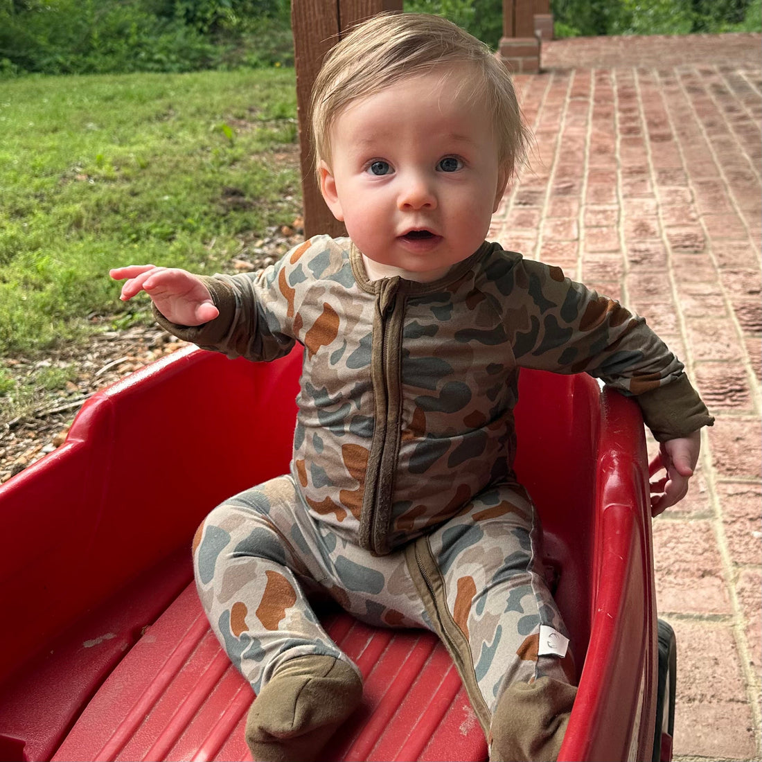 Baby Zippy by Bow Crew Apparel featuring woodland camouflage pattern, perfect for outdoor and bow hunting lifestyle wear.