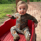 Baby Zippy by Bow Crew Apparel featuring woodland camouflage pattern, perfect for outdoor and bow hunting lifestyle wear.