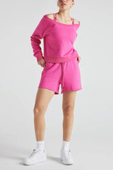 Pink off-shoulder sweatshirt by Fitkitty Culture, casual women’s clothing, featuring a relaxed fit and soft fabric.