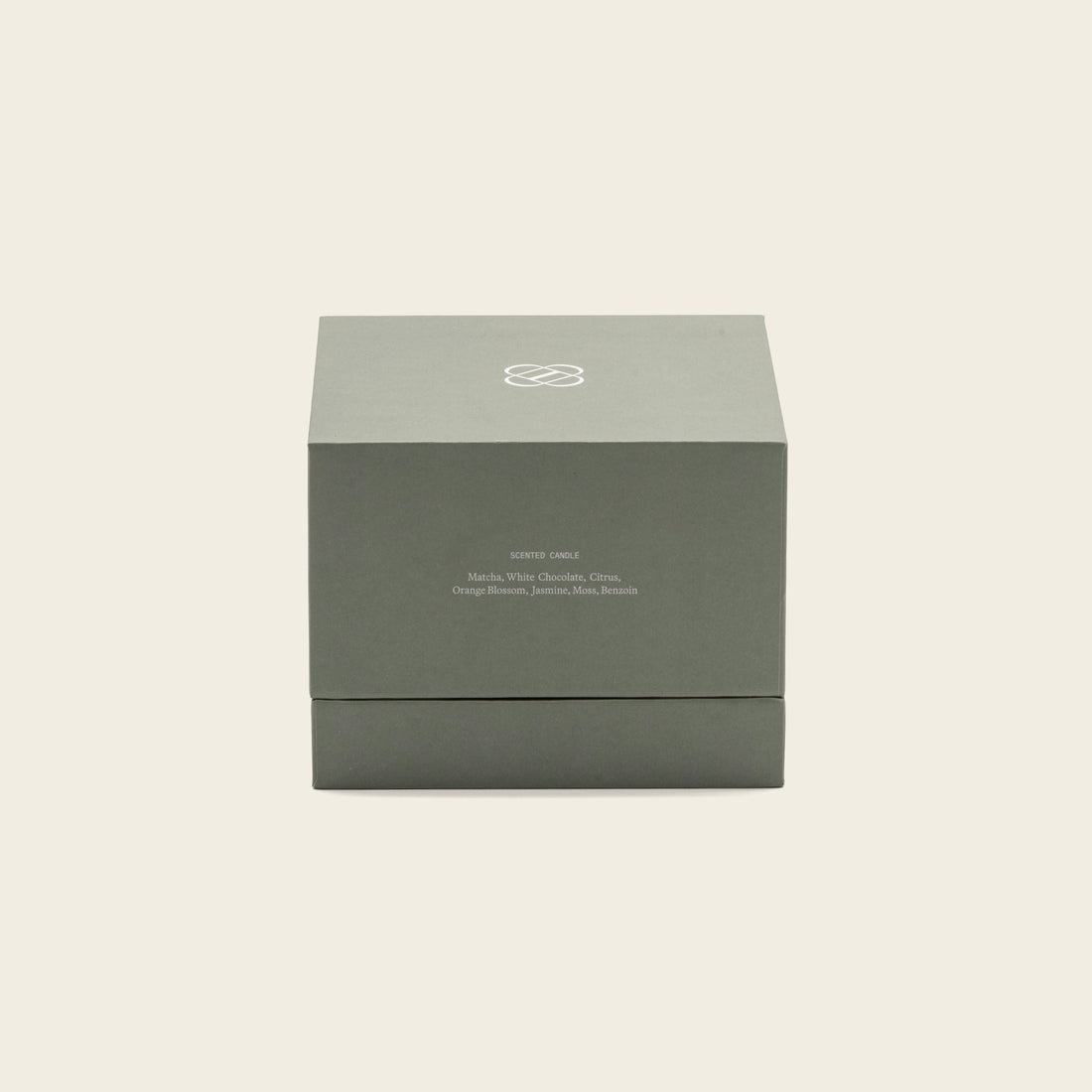 Soy wax ceramic candle by Italic in a minimalist white ceramic holder with a lit wick and a soft glow.