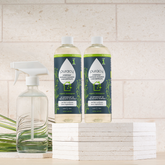 Puracy Everyday Multi-Surface Cleaner in a 16oz bottle, two-pack, featuring a clear spray bottle with green label and spray nozzle.