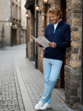 White Water Life Freeport Pant versatile performance pants shown hanging in doorway, highlighting casual and functional design.