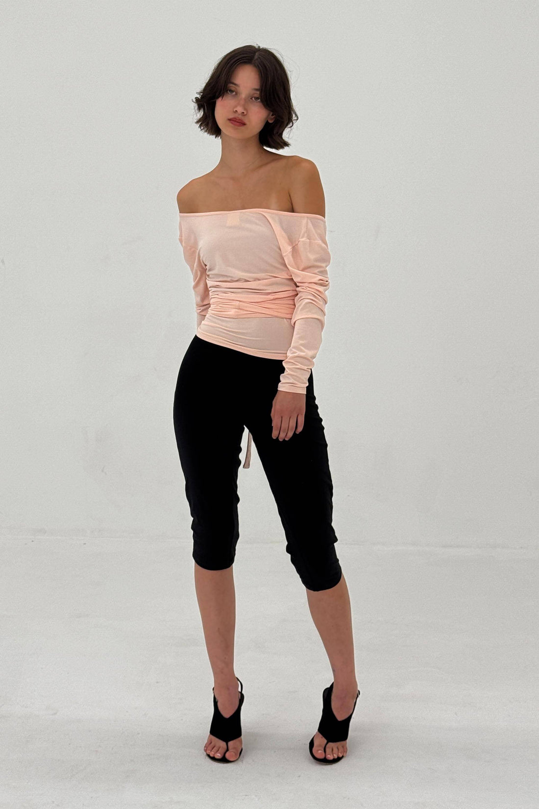 Powder pink Ballerina Wrap Top by findmenowthelabel displayed on a model, showcasing soft fabric and stylish wrap design.