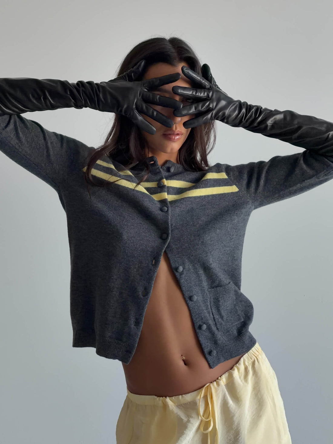 Charcoal and butter stripe cashmere wool cardigan from findmenowthelabel, showing a cozy knitwear with a button-front design.