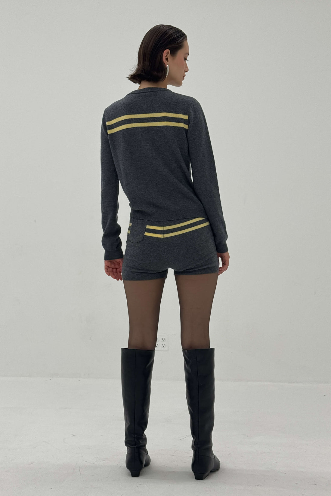 Charcoal and butter striped cashmere wool cardigan by findmenowthelabel, featuring a cozy knitwear design with a button front.