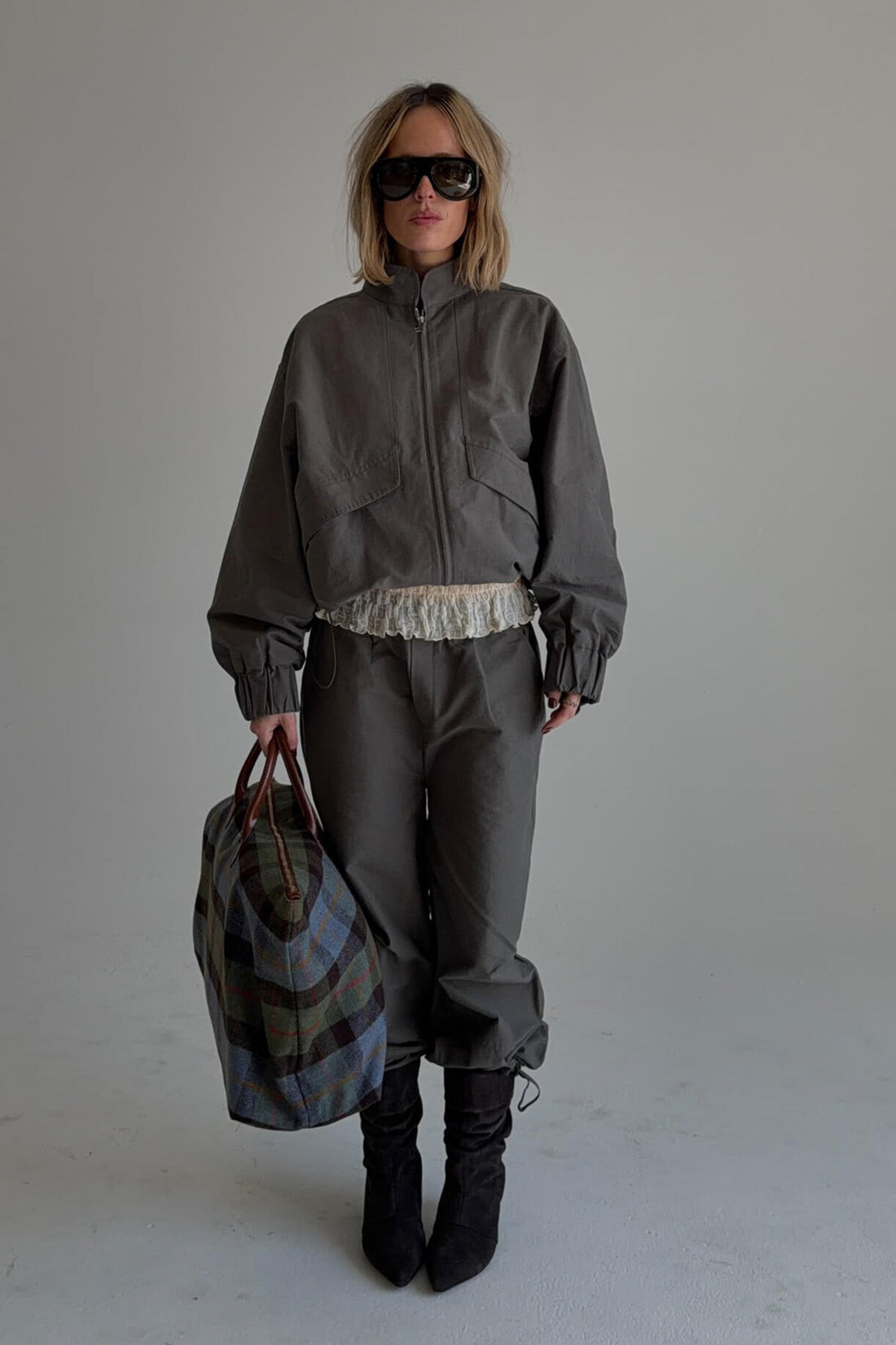 Findmenowthelabel charcoal sable pants with a relaxed fit, featuring a smooth fabric and tailored waistband.