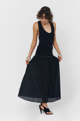 Black YUNA tank top by findmenowthelabel, featuring a sleeveless design and casual fit, shown on a model.