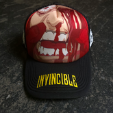 Black Face Smasher Trucker Hat by Any Means Necessary Clothing with mesh back and adjustable snap closure.