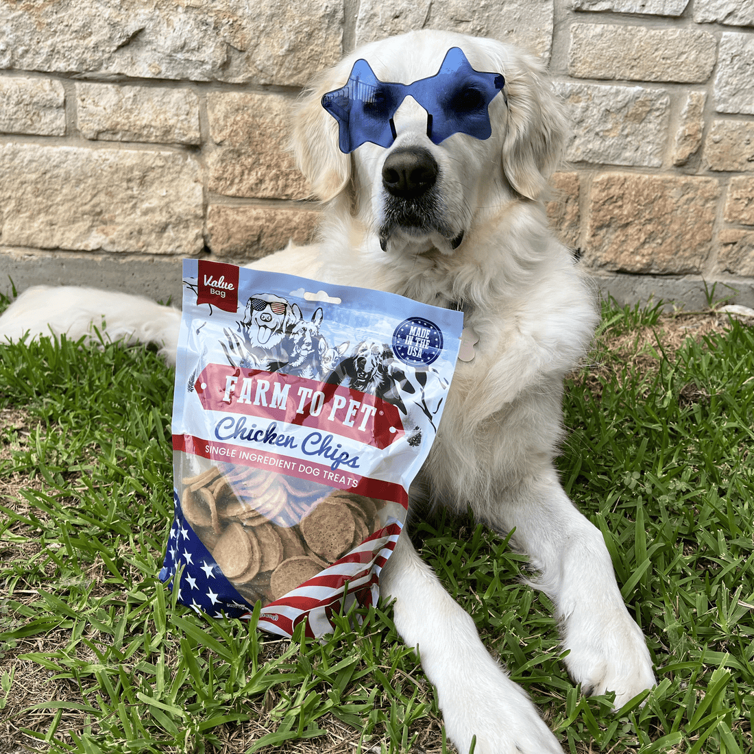 Farm To Pet Americana Chicken Chips for dogs in a 12oz bag, healthy USA-made dog treats with a dog wearing sunglasses.