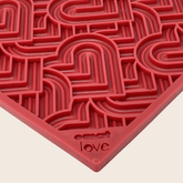Close-up of large red heart-patterned Farm To Pet dog lick mat showing textured surface for engaging pets.