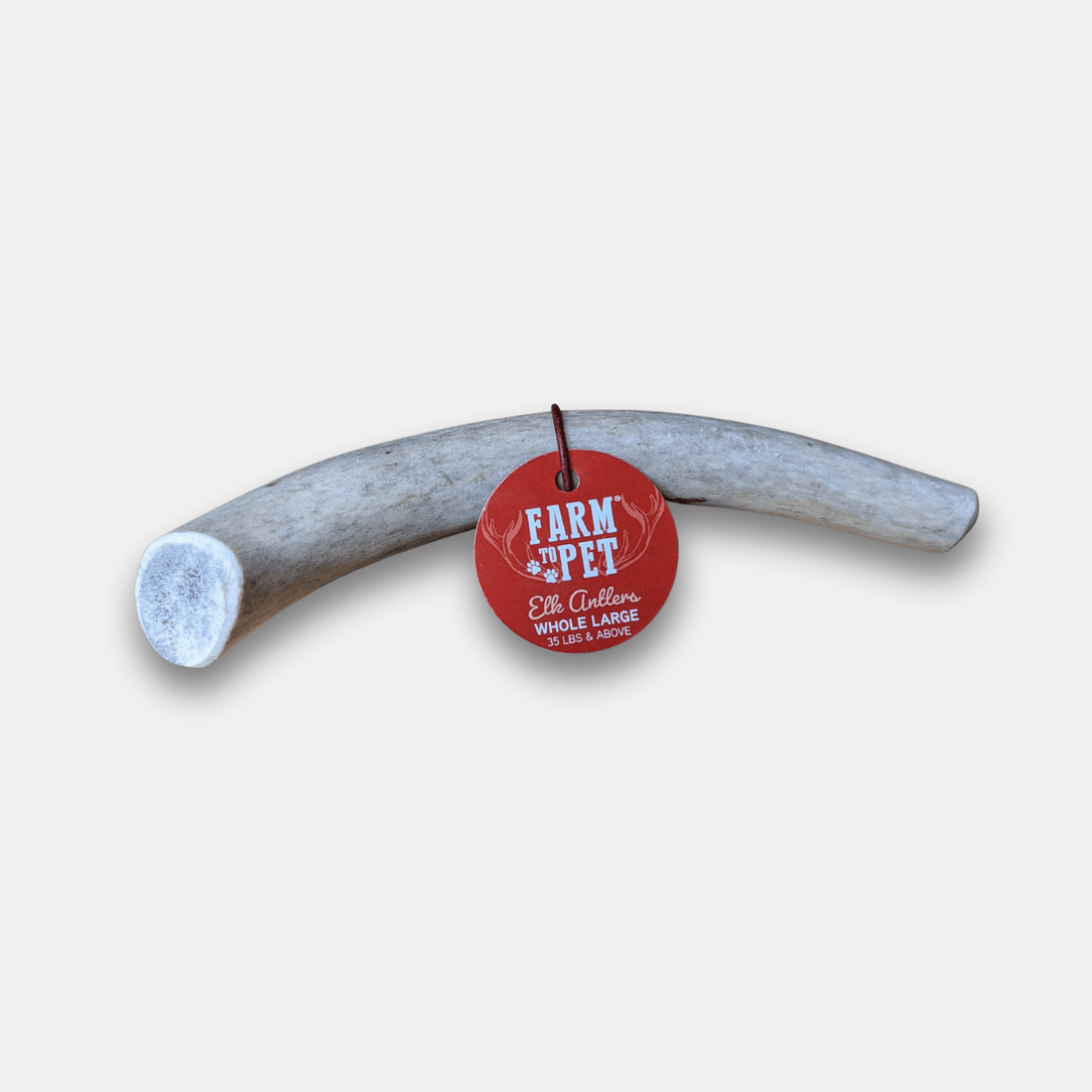 Large all-natural elk antler dog chew from Farm To Pet, showing a split whole elk antler for strong, long-lasting dog chews.