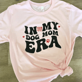 Pink Farm To Pet "Dog Mom Era" T-shirt featuring a front graphic, perfect for dog moms and dog lovers.