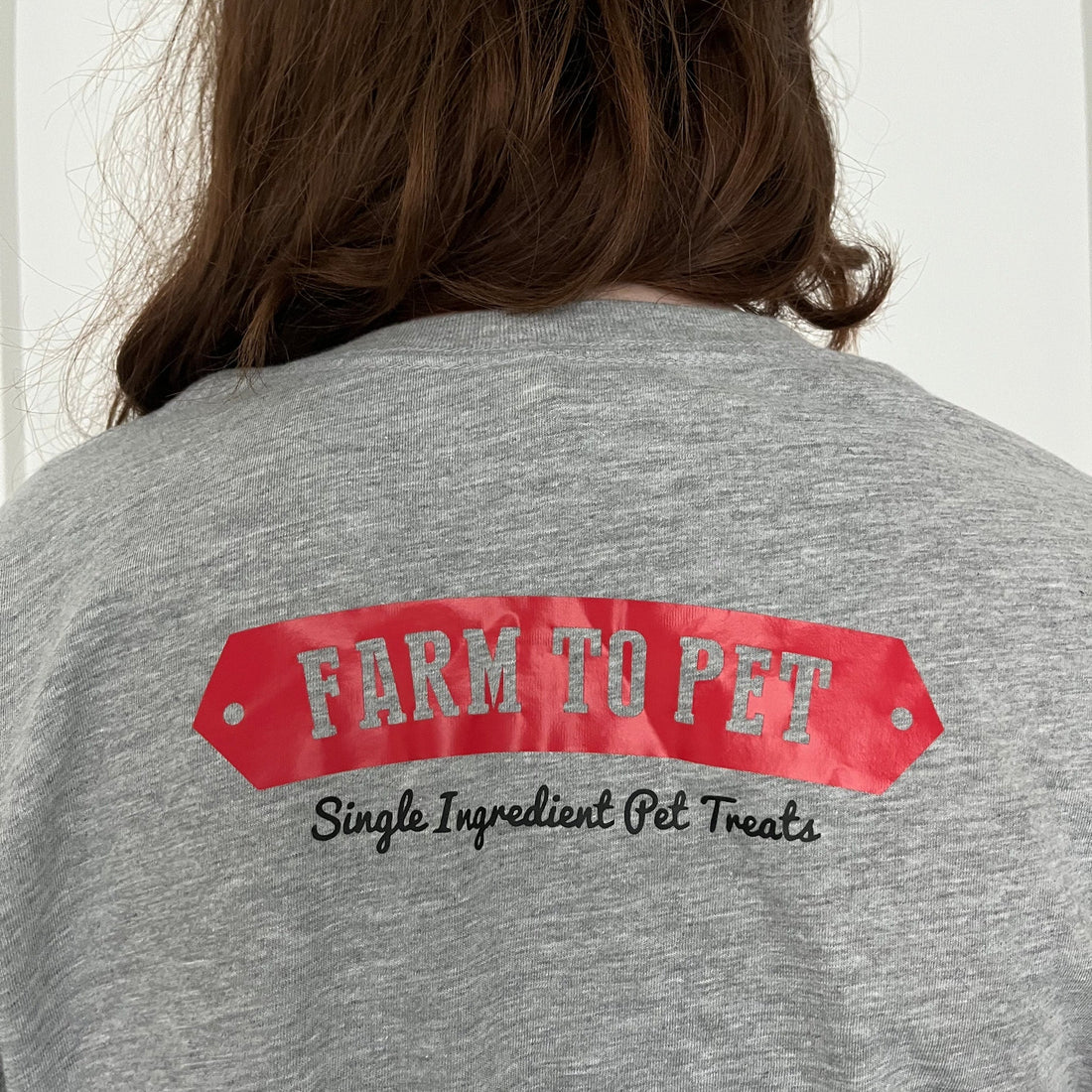 Gray Farm to Pet logo T-shirt with front and back views, showcasing casual fit and branded design for pet lovers.
