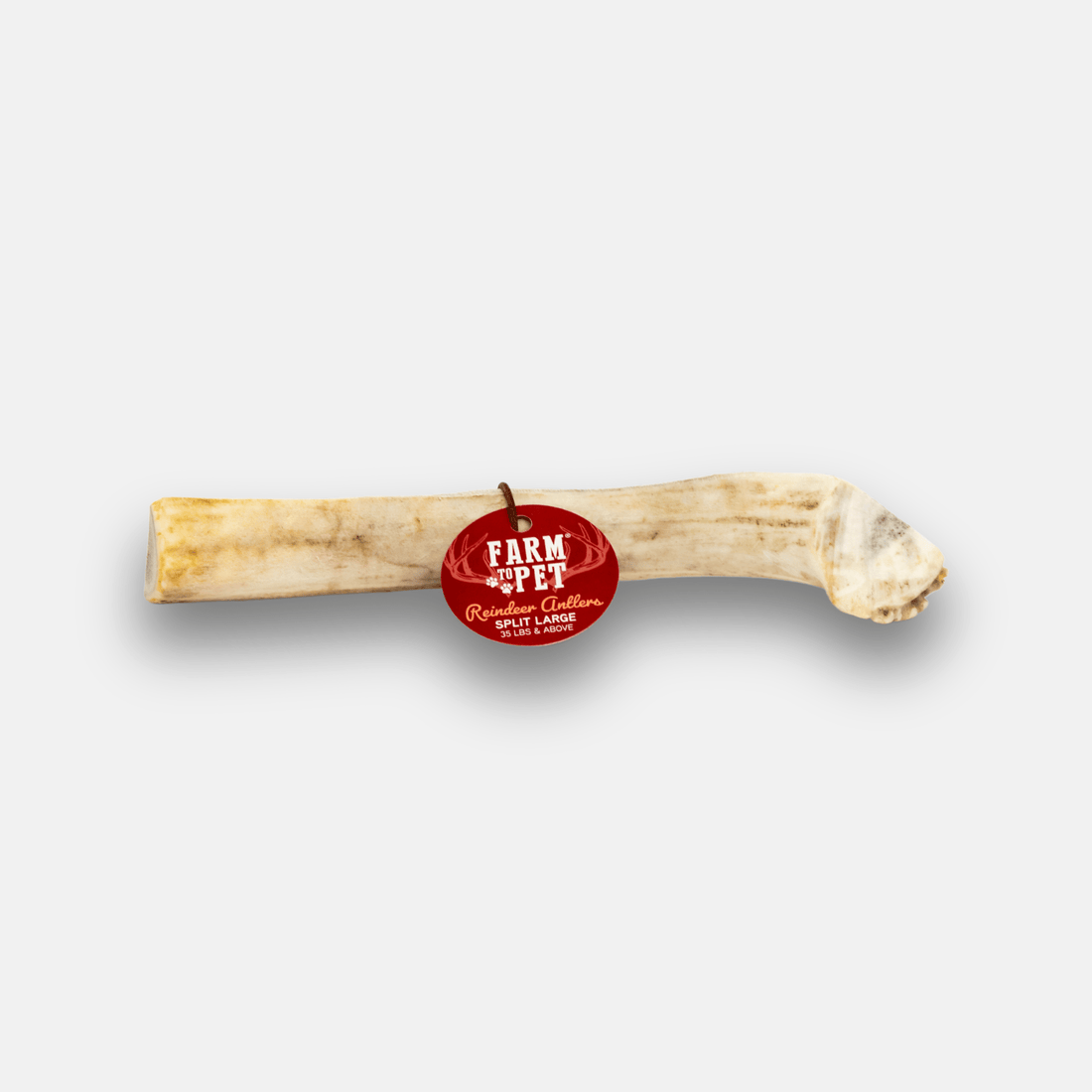 Organic reindeer antler dog chew from Farm To Pet, featuring a large split antler with textured surface for dogs to chew and gnaw.