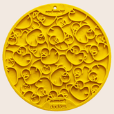 Close-up of yellow Farm To Pet round dog lick mat with suction cups and duck design for engaging pet treats.