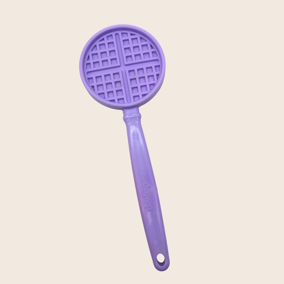 Close-up of Farm To Pet purple waffle lick stick, an interactive dog training toy designed for canine enrichment and mental stimulation.