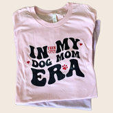 Pink "Dog Mom Era" T-shirt by Farm To Pet featuring a stylish design, perfect for dog moms.