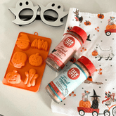 Orange Halloween-themed pet treat mold by Farm To Pet with filled sections, designed for making dog treats.