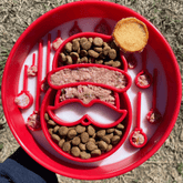 Red Santa-themed slow feeder dog bowl by Farm To Pet with holiday design, perfect for slowing down feeding for dogs.