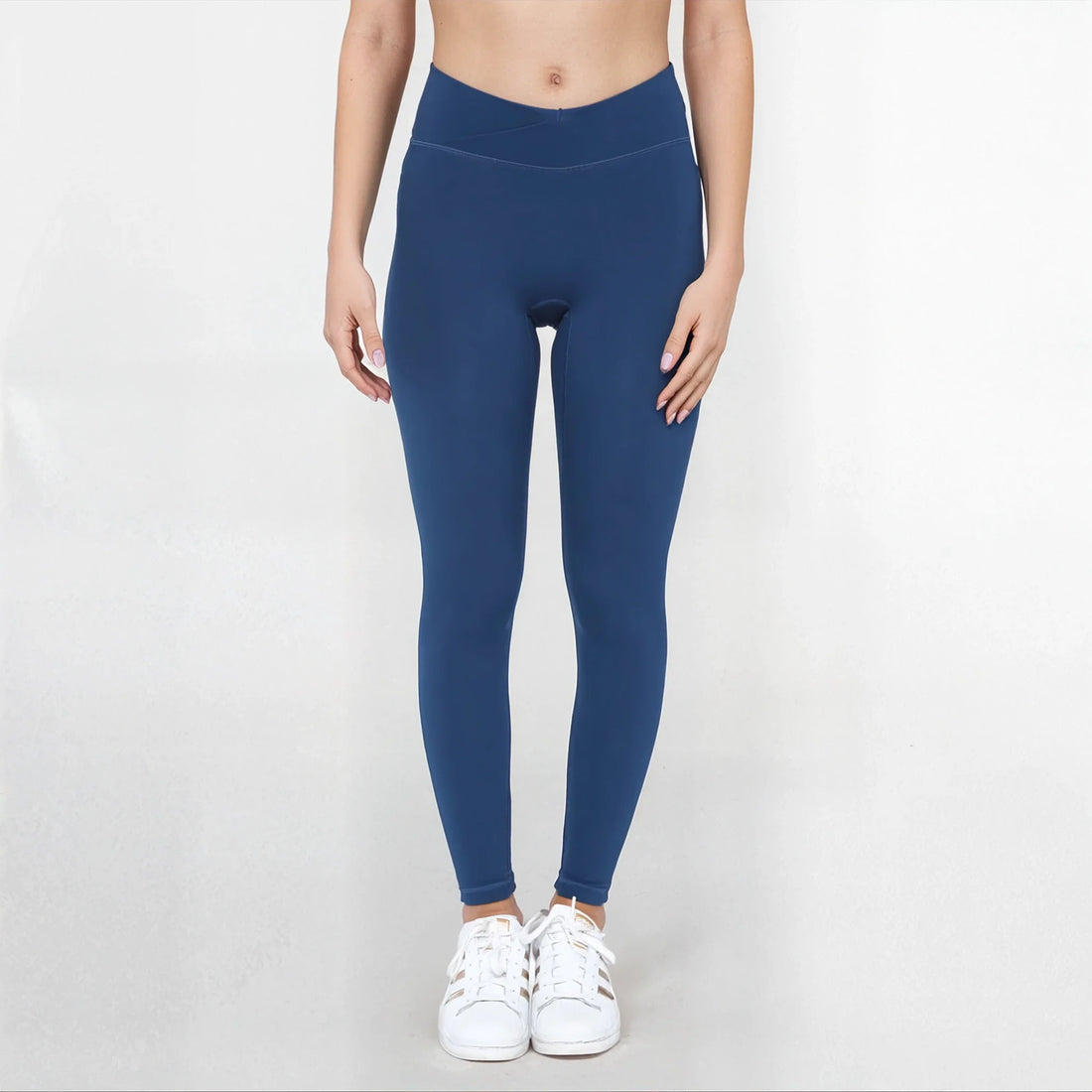 Black SmoothFit Crossover Leggings by Fitkitty Culture, stretchy athletic leggings for yoga and active wear, shown on a model.