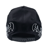 Structured Forsaken Hat by Any Means Necessary Clothing, featuring a stylish design and adjustable strap on a clean background.