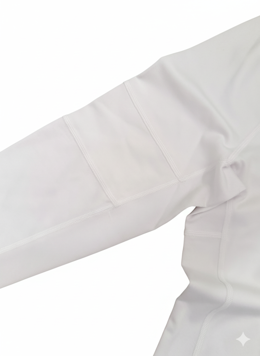 Goal Five Foudy mid-weight long sleeve training top with ½ zip in white, designed for comfortable athletic wear.