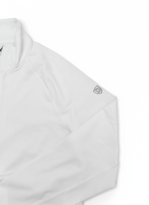 Goal Five Foudy mid-weight long sleeve training top with ½ zip and logo on sleeve, in white.